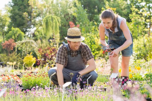 Gardener inspecting a garden in Regents Park