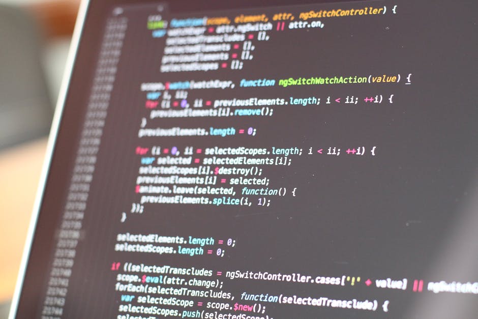 A close-up of a computer screen displaying lines of colorful code, with syntax highlighting in shades of blue, pink, yellow, and green on a dark background. The code appears to be JavaScript, featurin